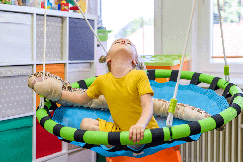 Neurodivergent kid on a sensory swing